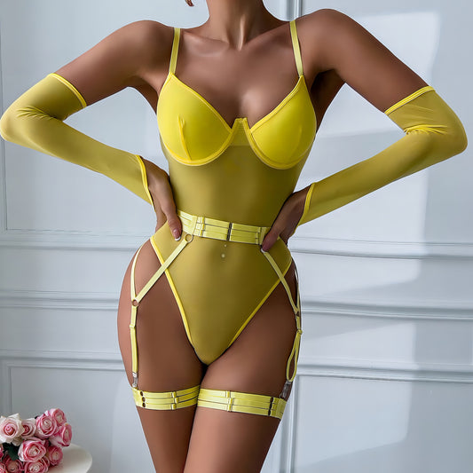 Woman wearing a luxury yellow mesh 3-piece lingerie set with embroidery, including underwire bra, garter belt, and matching thong