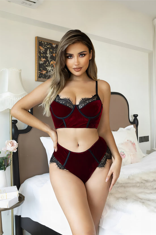 Woman wearing a red mesh 2-piece lingerie set with embroidery, posing on a white background