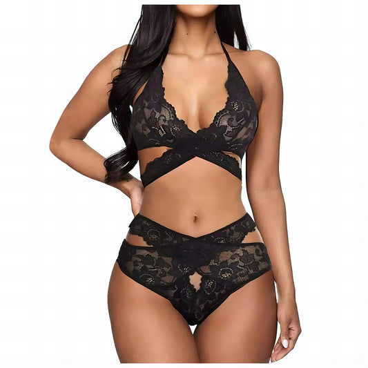 Woman wearing a black mesh 2-piece lingerie set with embroidery, posing on a white background