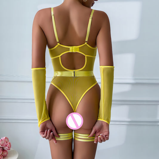 Woman wearing a luxury yellow mesh 3-piece lingerie set with embroidery, including underwire bra, garter belt, and matching thong