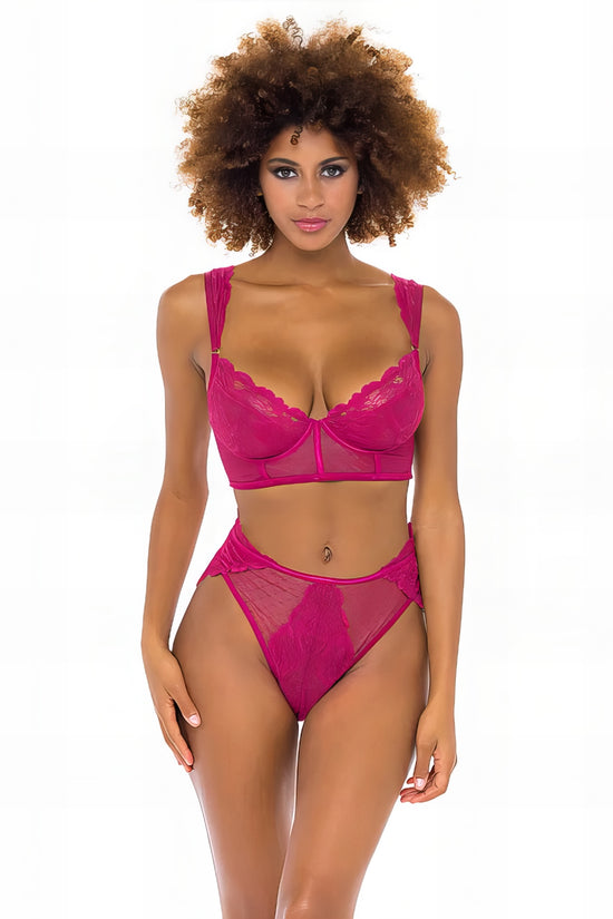 Woman wearing a pink mesh 2-piece lingerie set with embroidery, posing on a white background