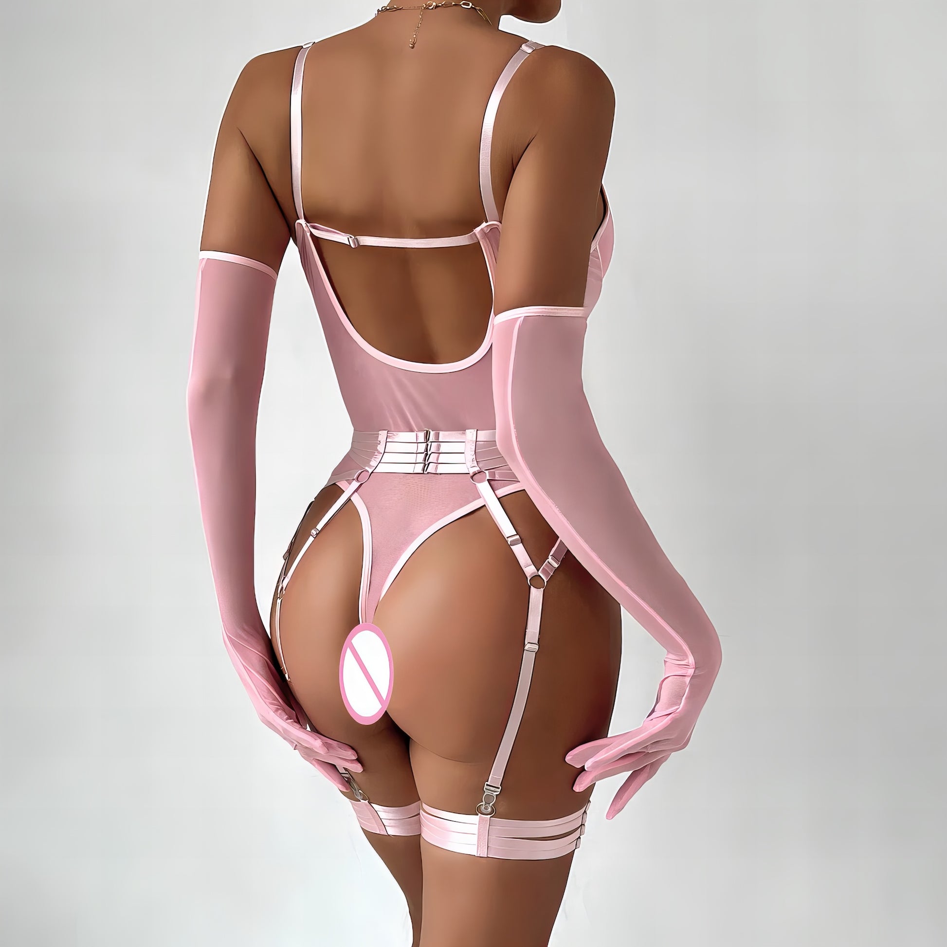 Woman wearing a luxury pink mesh 3-piece lingerie set with embroidery, including underwire bra, garter belt, and matching thong