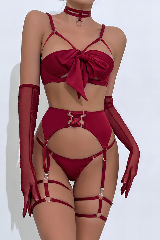 Woman wearing a red mesh 2-piece lingerie set with embroidery, posing on a white background