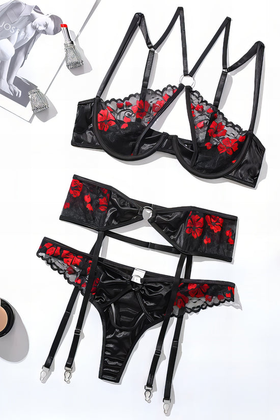 Woman wearing a black mesh 2-piece lingerie set with embroidery, posing on a white background