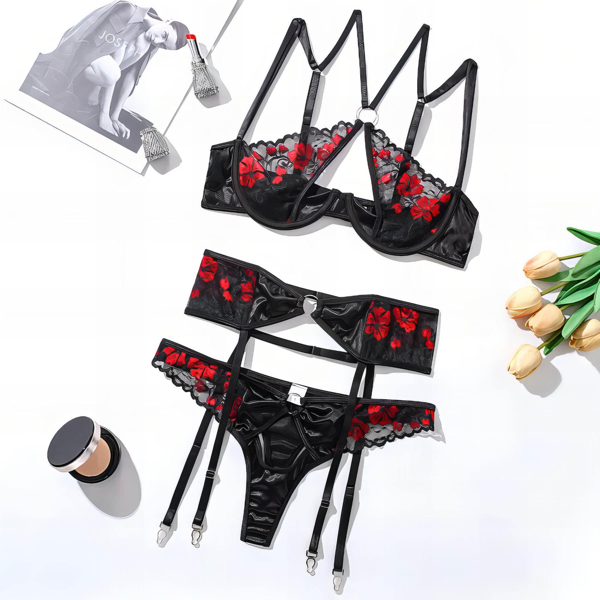 Woman wearing a black mesh 2-piece lingerie set with embroidery, posing on a white background