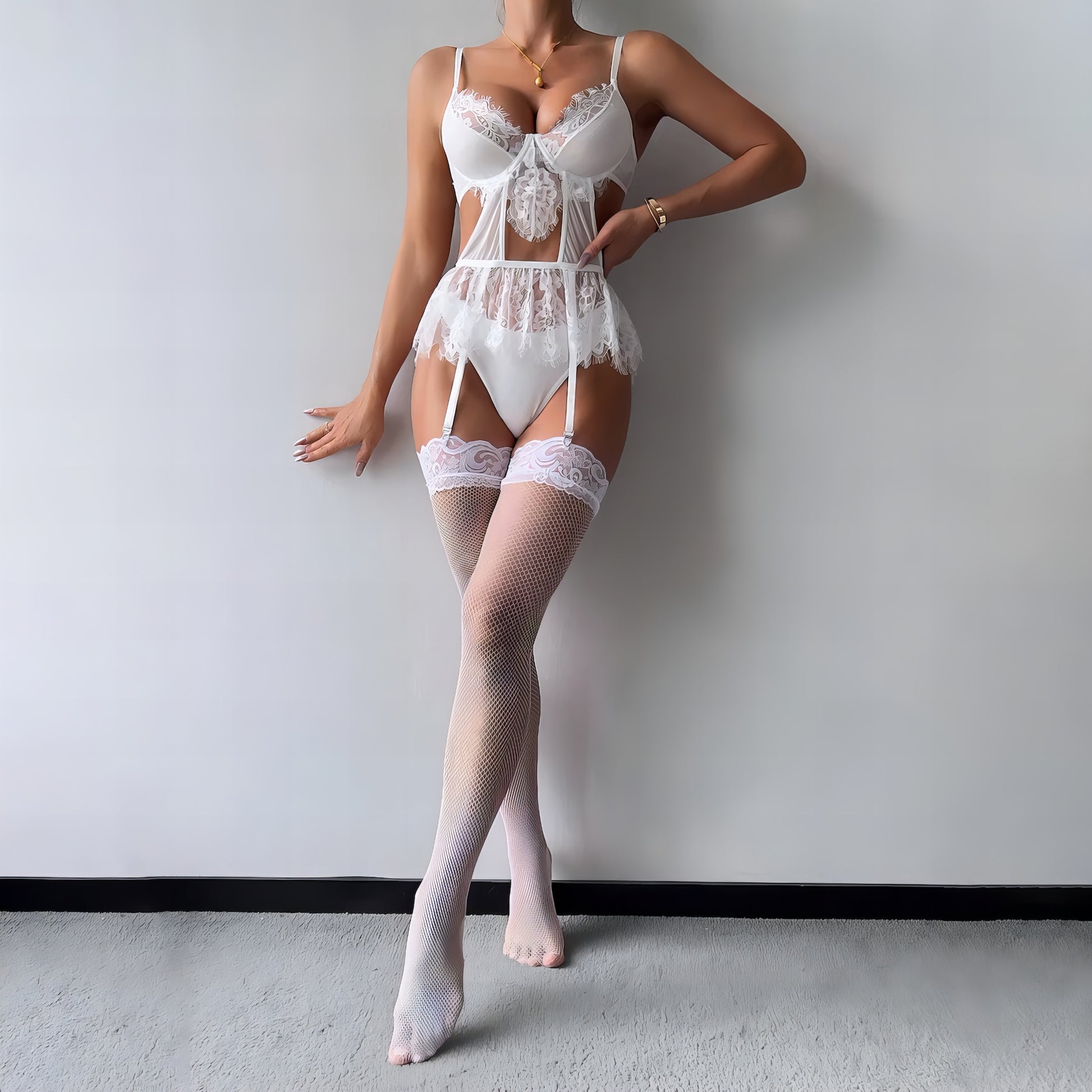 Woman wearing a white mesh 2-piece lingerie set with embroidery, posing on a white background